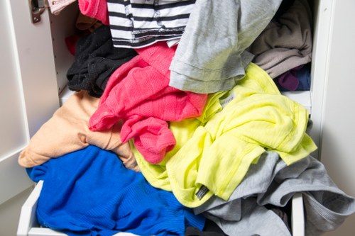 Workers loading a small flat clearance