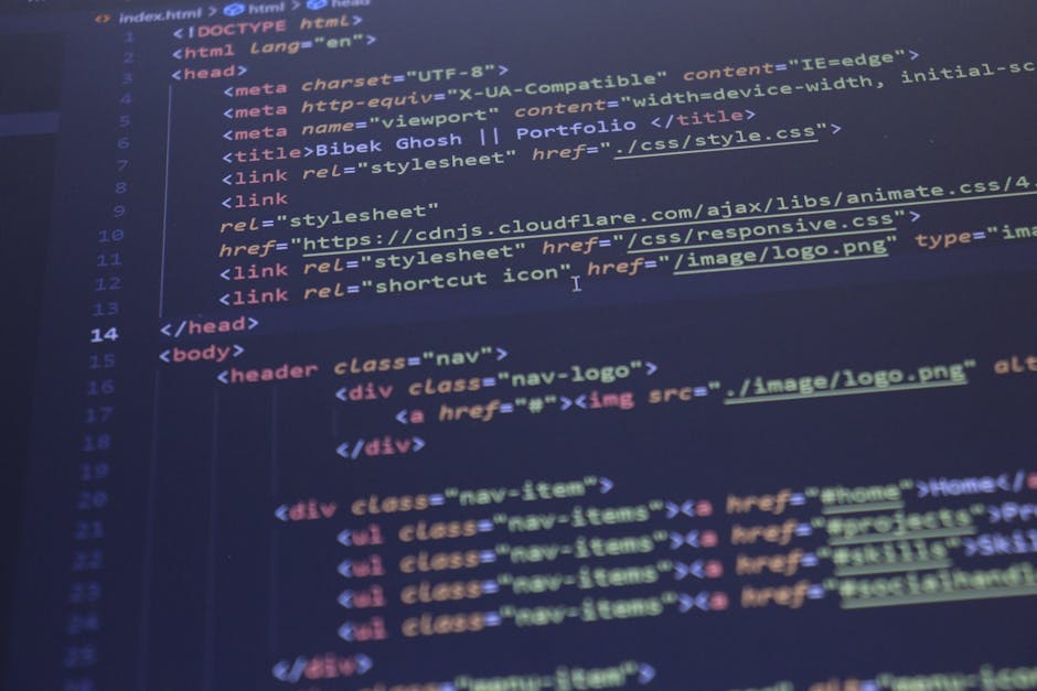 The image displays a close-up view of a computer screen with a dark background featuring lines of HTML and CSS code in various colors, including yellow, red, blue, and green. The code appears to inclu